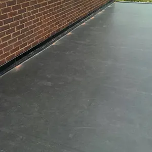 A man riding a skateboard down the side of a building.
