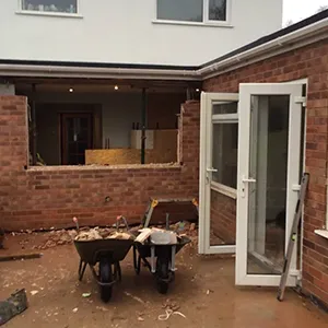 A brick house with a patio and patio furniture.