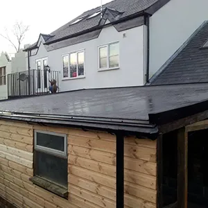 A house with a roof made of wood.